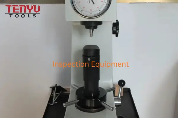 Technician performing a run-out test on an SDS drill bit