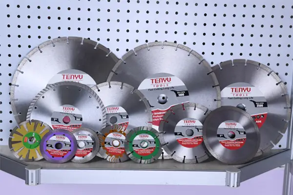 Industrial stone cutting tools including saw blades and grinding wheels