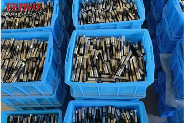 CNC grinding machine working on a square hole drill bit