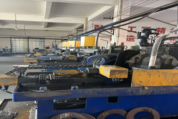 Close-up of CNC grinding machine finishing cobalt drill bits