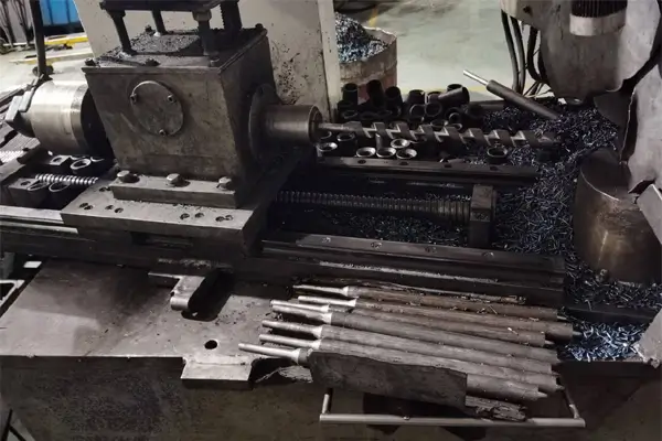 Automated milling machine cutting spiral flutes on drill bits